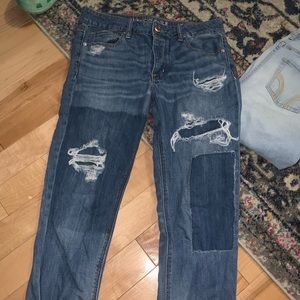 Distressed “tomgirl” jeans